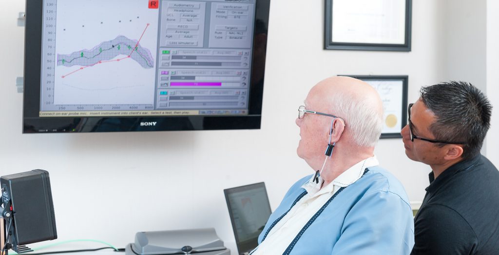 Steve explaining hearing loss to patient